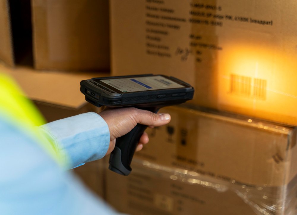 Courier handing parcel with UPS label and barcode scanner