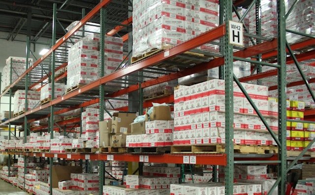 Warehouse aisles with pick-and-pack operations for EU orders