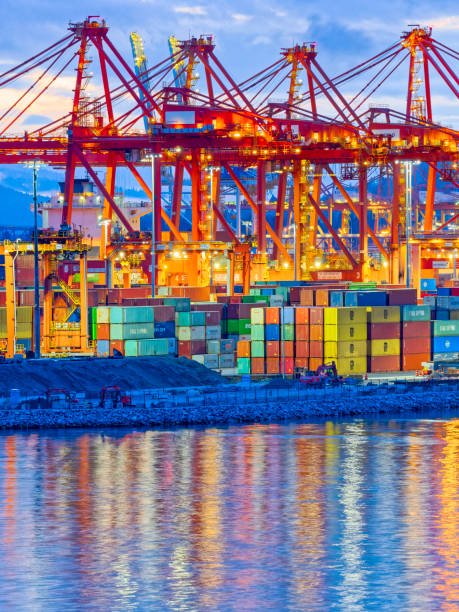 Container vessel departing Port of Vancouver at dusk